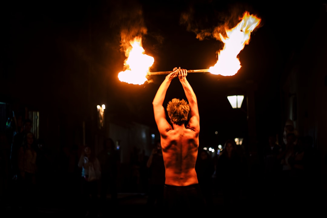 man demonstrating fire dance